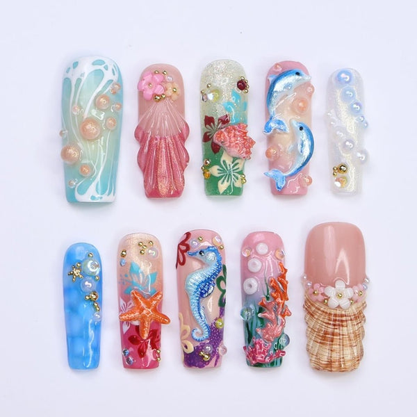 3D ocean press on nails with dolphins, seahorse, starfish, coral reef, and tropical flowers — featuring vibrant colors, glitter seashells, pearl bubbles, and sculpted textures — beach vacation nails, mermaid core press on nails, custom handmade nail art, fake nails, false nails, pressons — perfect for summer getaways, tropical looks, or gifting for ocean lovers.