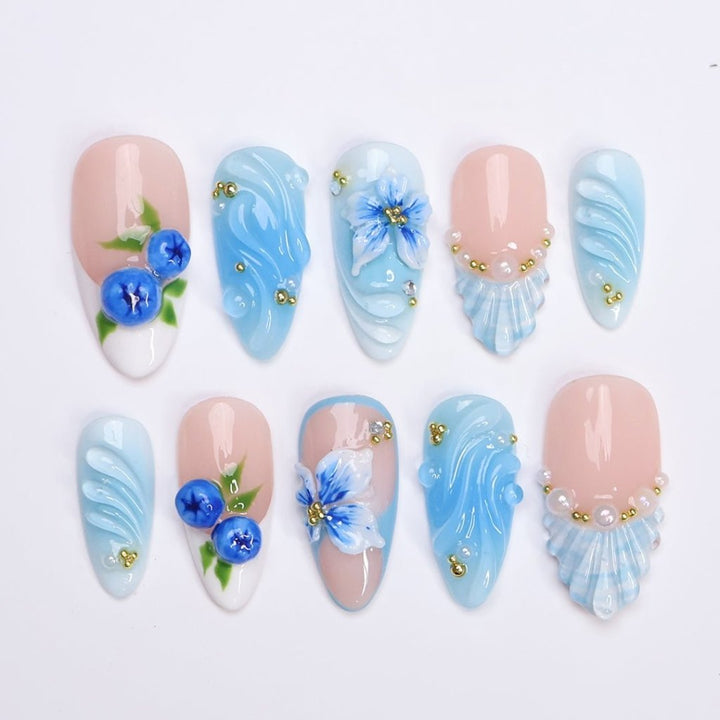3D ocean blue press on nails with blueberries, sculpted flowers, and seashell accents — featuring glossy wave textures, pearl embellishments, and soft gradient blues — summer vacation nails, coastal press on nails, custom handmade nail art, fake nails, false nails, pressons — perfect for beach holidays, ocean-inspired looks, or gifting for her.

