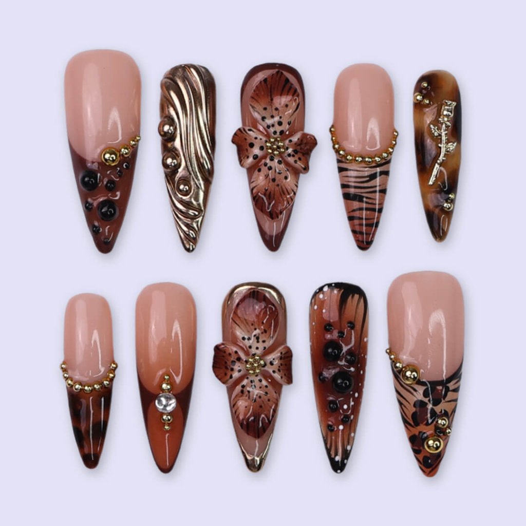 Luxury press-on nails with animal print, 3D floral designs, gold accents, and deep amber tones — handmade long stiletto nails — perfect for jungle-inspired nails, luxury statement nail art, and bold elegant looks.