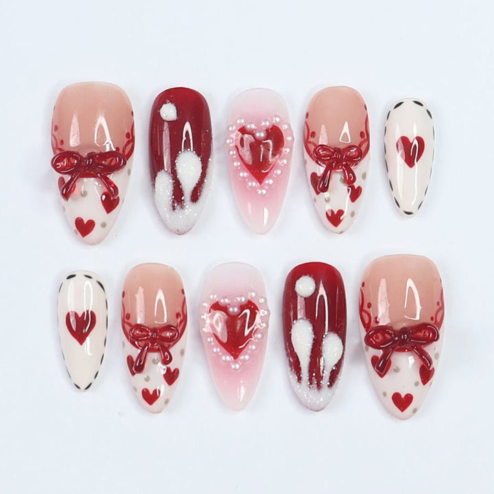 Celebrate love with the Valentine’s Kiss Handmade Press-On Nails, a stunning combination of red and white hues, heart details, and intricate 3D bows. These nails radiate romance and elegance, making them perfect for Valentine’s Day, anniversaries, or as a thoughtful gift.