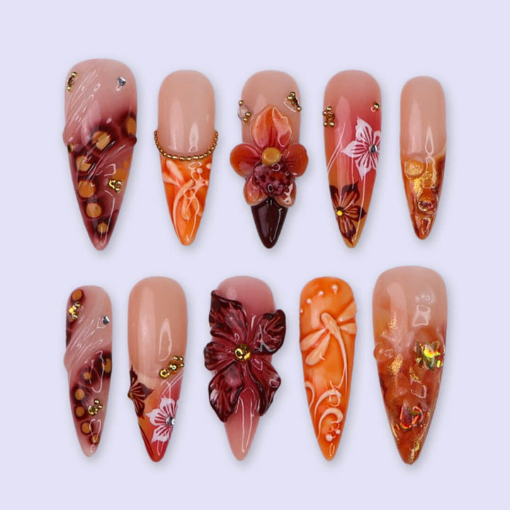 Luxury press-on nails with fiery red and orange gradients, 3D florals, golden flecks, and shimmering accents inspired by dragonfly — handmade long almond nails — perfect for bold fall looks, holiday, birthday
