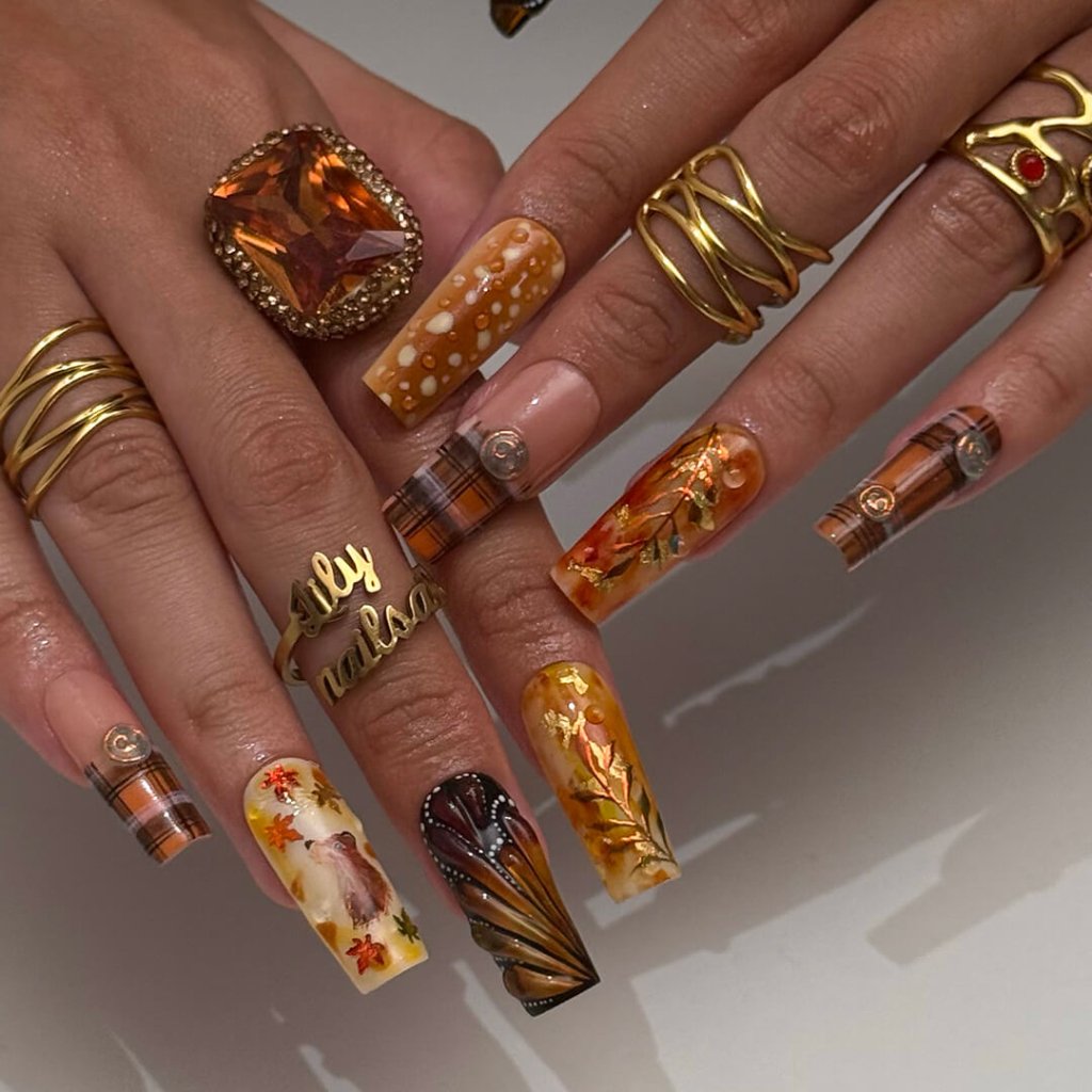 Luxury press-on nails with plaid patterns, golden foil leaves, tortoiseshell swirls, and warm caramel tones — handmade long almond nails — perfect for fall-inspired nail art, luxury everyday style, or elegant seasonal looks.