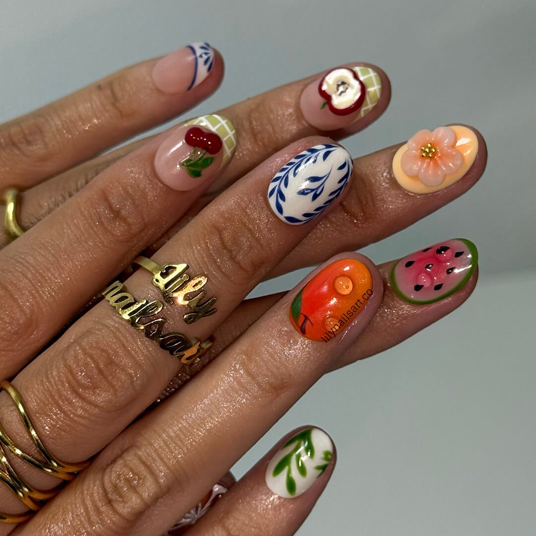 3D summer nails with sculpted cherries, watermelon, apples, orange flowers, leafy vines, and purple shells —  custom made fruit nail art in gingham and abstract patterns — perfect for summer picnics, garden parties, beach holiday, vacation 