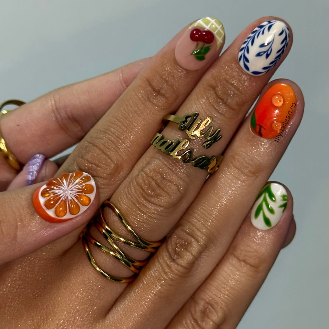 3D summer nails with sculpted cherries, watermelon, apples, orange flowers, leafy vines, and purple shells —  custom made fruit nail art in gingham and abstract patterns — perfect for summer picnics, garden parties, beach holiday, vacation 