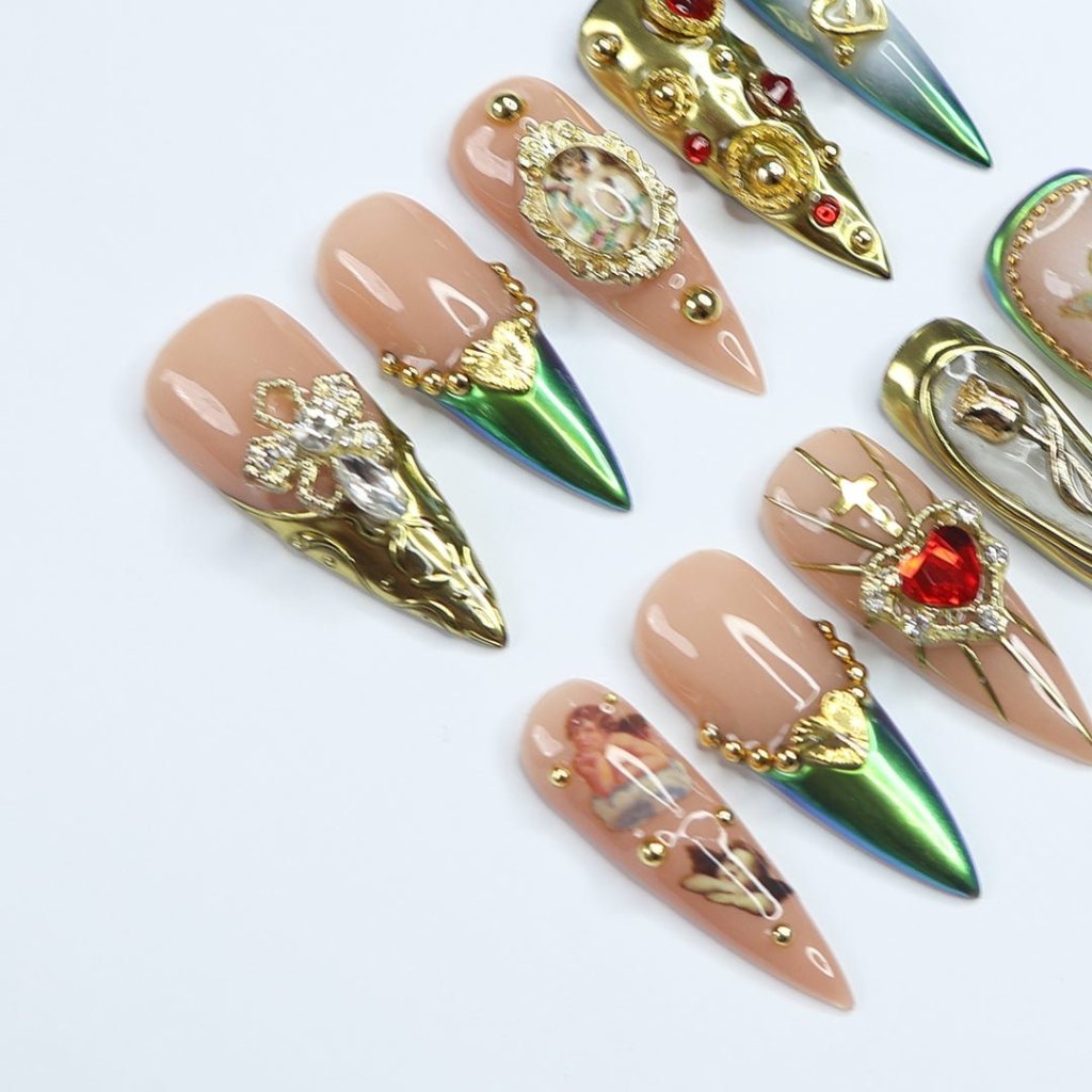Opulent, regal, and dripping in old-money glamour. Baroque gold, deep emerald hues, and vintage cherub accents create a masterpiece worthy of a Renaissance muse. Intricate 3D embellishments, sparkling gemstones, and delicate filigree details make every nail feel like a mini work of art. If you love luxury, romance, and timeless elegance, this set is calling your name.