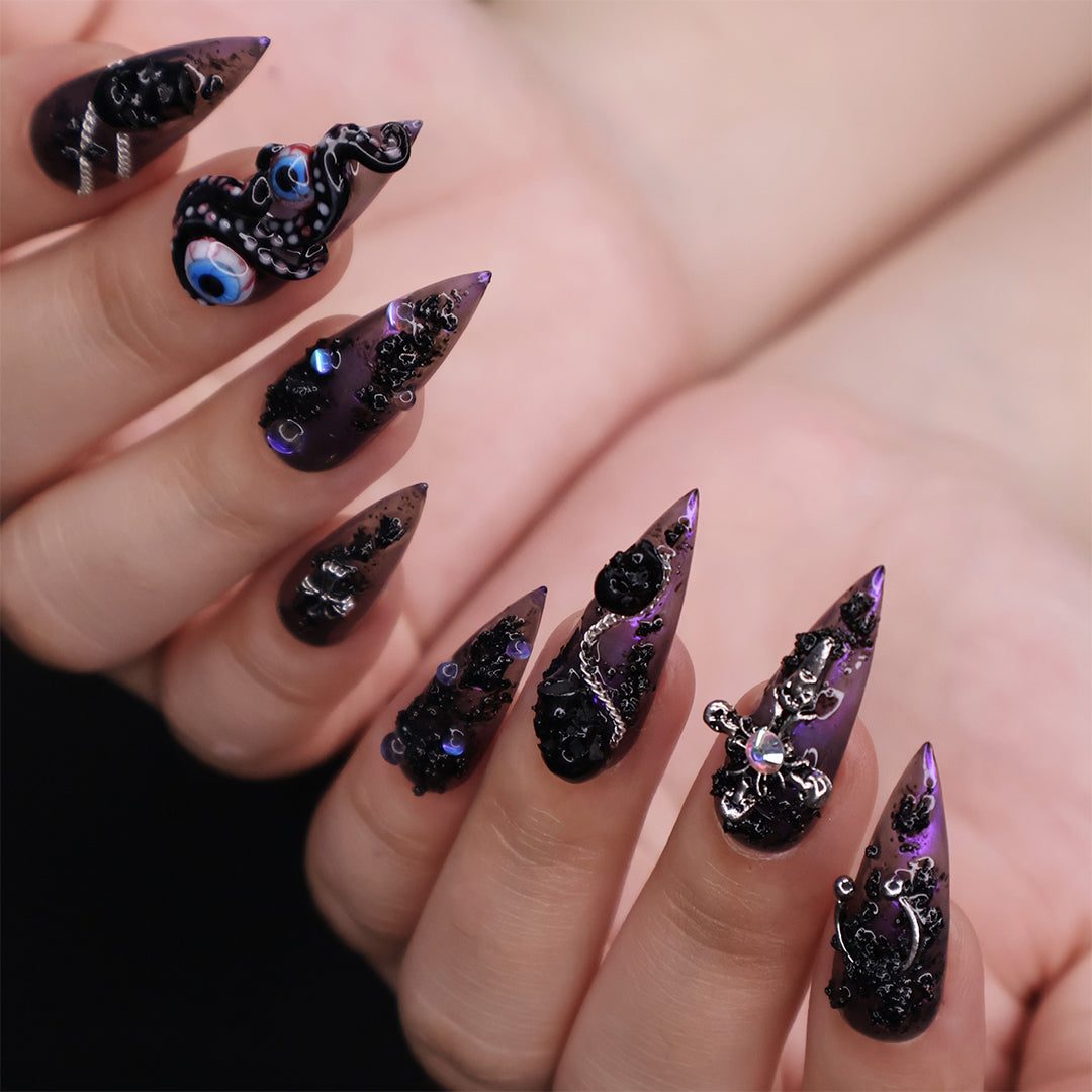 Black and purple chrome press on nails with eerie, horror-inspired handmade 3D elements — custom gothic nails, stiletto press ons, handmade false nails, spooky nail art — perfect for Halloween season, alt fashion, and dark feminine energy.