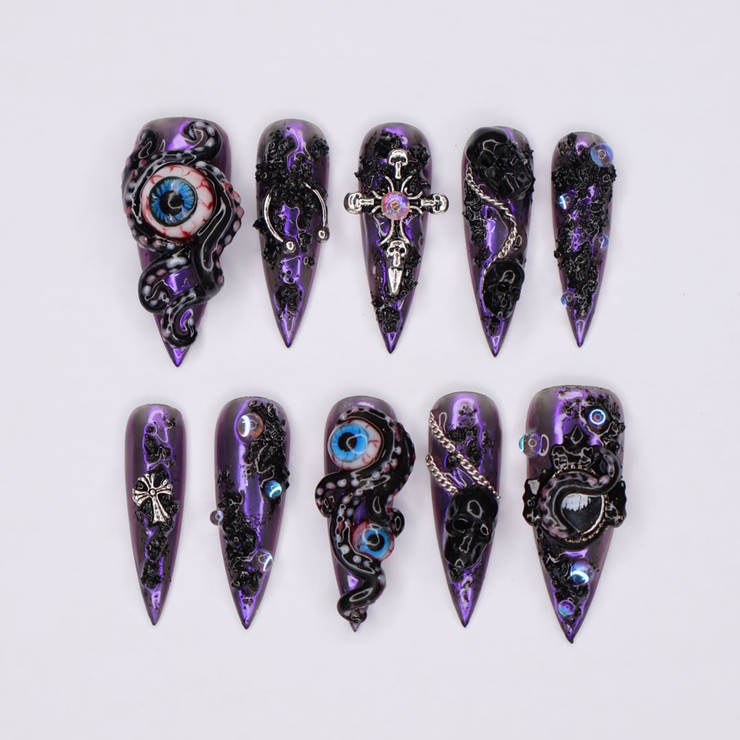 Black and purple chrome press on nails with eerie, horror-inspired handmade 3D elements — custom gothic nails, stiletto press ons, handmade false nails, spooky nail art — perfect for Halloween season, alt fashion, and dark feminine energy.