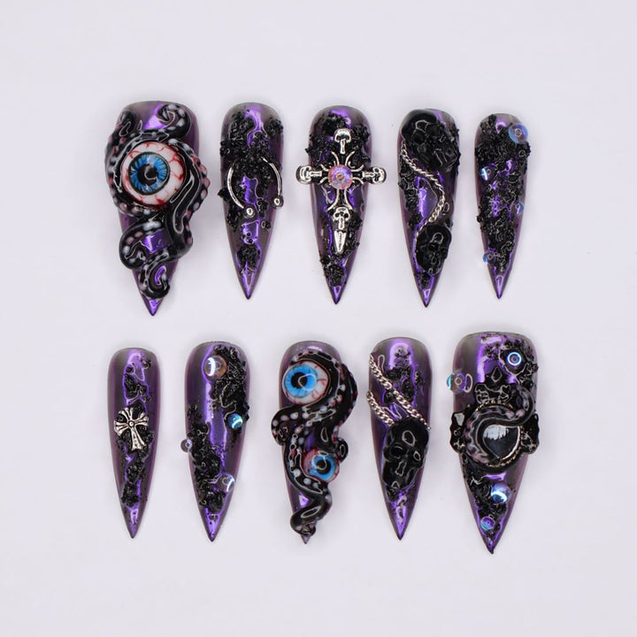 Black and purple chrome press on nails with eerie, horror-inspired handmade 3D elements — custom gothic nails, stiletto press ons, handmade false nails, spooky nail art — perfect for Halloween season, alt fashion, and dark feminine energy.