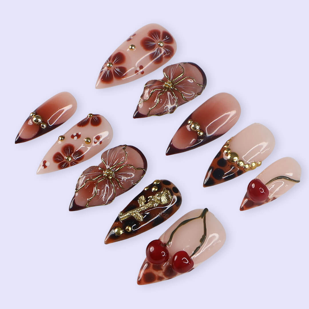 Medium stiletto press on nails with red cherry accents, 3D floral designs, tortoiseshell tips, and gold embellishments — luxury handmade false nails for date nights, self-expression, or gifting. Custom press on nails, reusable nail art, fake nails for beauty lovers.