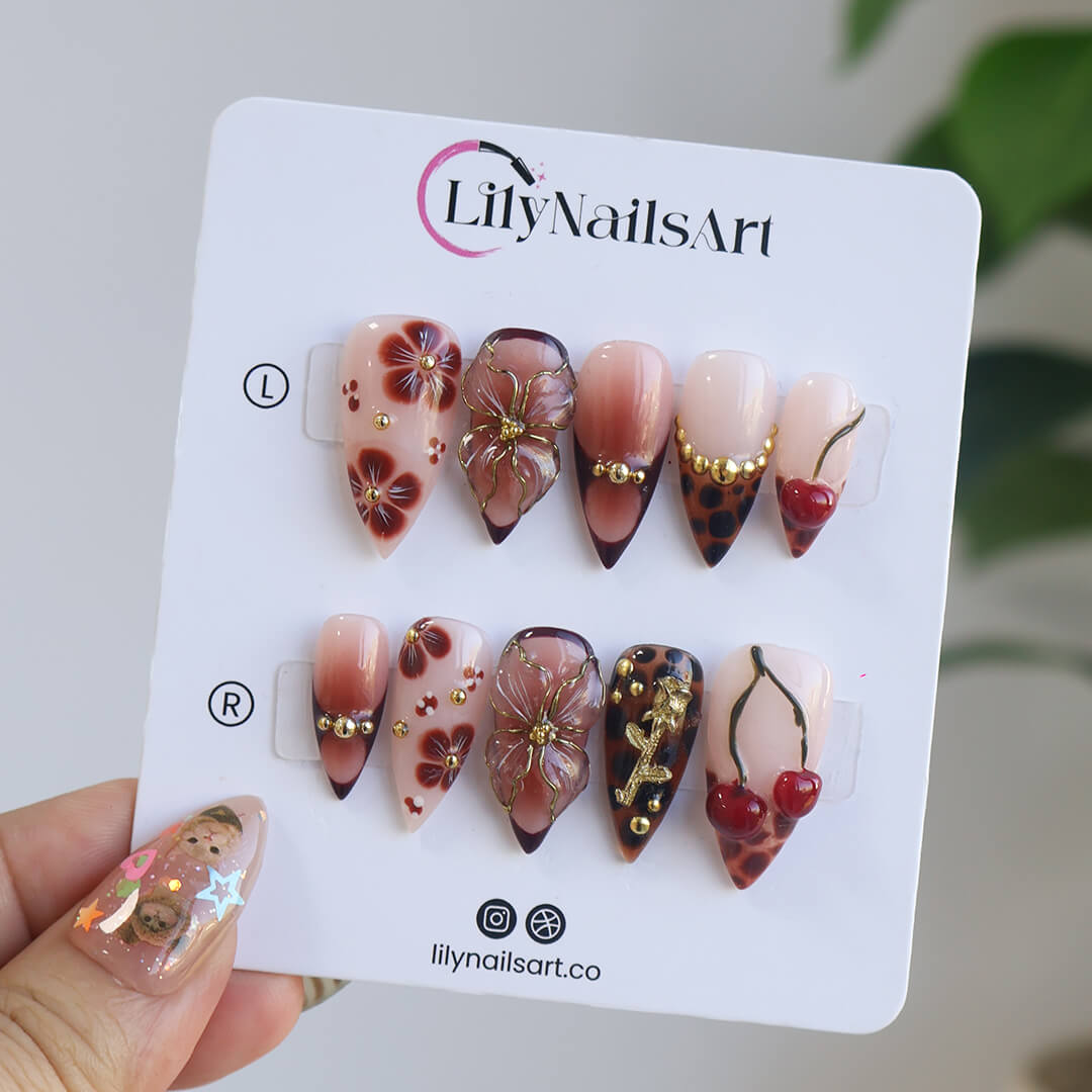 Medium stiletto press on nails with red cherry accents, 3D floral designs, tortoiseshell tips, and gold embellishments — luxury handmade false nails for date nights, self-expression, or gifting. Custom press on nails, reusable nail art, fake nails for beauty lovers.