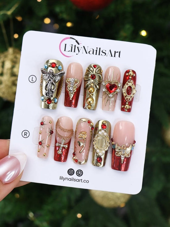 Renaissance-inspired red and gold press on nails with 3D baroque charms, gothic gemstone accents, and ornate metallic detailing — handmade luxury press ons, reusable nail art, false nails, fake nails — perfect for holiday parties, Christmas glam, or editorial photoshoots.