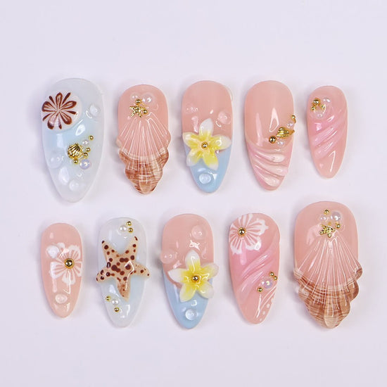 pastel summer nails  with seashells, daisies, starfish, and pearls — handmade luxury nail art in pastel pink and soft blue tones, reusable and custom-fit — perfect for beach getaways, tropical nails art for holiday, vacation, beach day