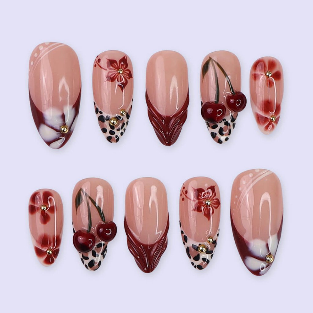 Cherry red press-on nails with hand-painted florals, subtle leopard accents, and glossy crimson tips — luxury handmade medium almond nails  — perfect for elegant  fall everyday looks, romantic evenings