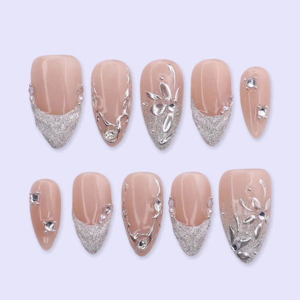 3D silver chrome press on nails with glitter V-tips and sculpted leaf accents, embellished with crystals and silver beads on a nude base — custom press on nails, luxury handmade nail art, fake nails, false nails, pressons — perfect for prom, winter formal, and silver-themed events