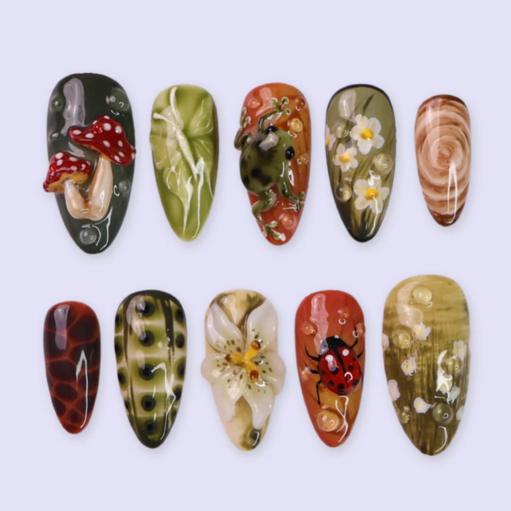 3D enchanted forest press-on nails with sculpted mushrooms, frogs, ladybugs, flowers, and woodland textures in earthy greens, browns, and reds — handmade medium almond nails — perfect for fairytale nail art, mystical styles, or fall luxury looks.