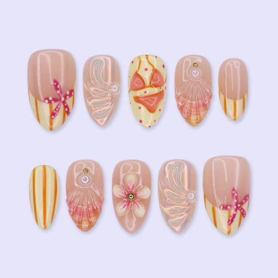 Handmade summer press-on nails with peach base, orange stripes, hand-painted bikini, pink starfish and iridescent seashell shimmer by Lily Nails Art