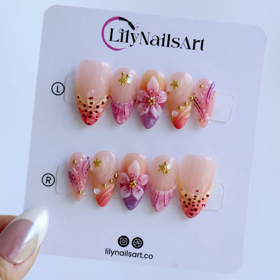 Handmade summer press-on nails with rose and lavender watercolour florals, 3D bloom centrepiece and gold star embellishments by Lily Nails Art