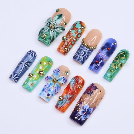 3D abstract press on nails with ocean-inspired patterns, dragonflies, sculpted florals, and swirl textures in deep green, navy, orange, and teal tones — handmade summer nails, tropical press on nails, luxury fake nails, false nails, pressons — perfect for bold vacation looks, artistic nail lovers, or gifting for her.