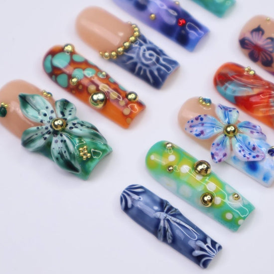 3D abstract press on nails with ocean-inspired patterns, dragonflies, sculpted florals, and swirl textures in deep green, navy, orange, and teal tones — handmade summer nails, tropical press on nails, luxury fake nails, false nails, pressons — perfect for bold vacation looks, artistic nail lovers, or gifting for her.