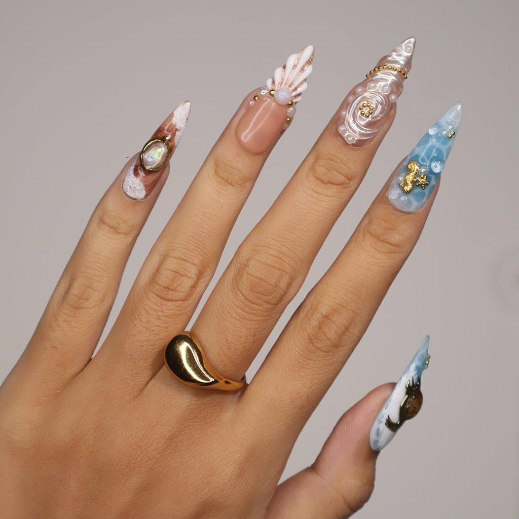 3D ocean press on nails with starfish, seashells, pearls, and turtles — featuring marble wave textures, gold accents, and sculpted shell designs in sandy nude, pearl white, and ocean blue tones — summer vacation nails, beach press on nails, custom handmade nail art, fake nails, false nails, pressons — perfect for coastal getaways, mermaid vibes, or tropical gifting.