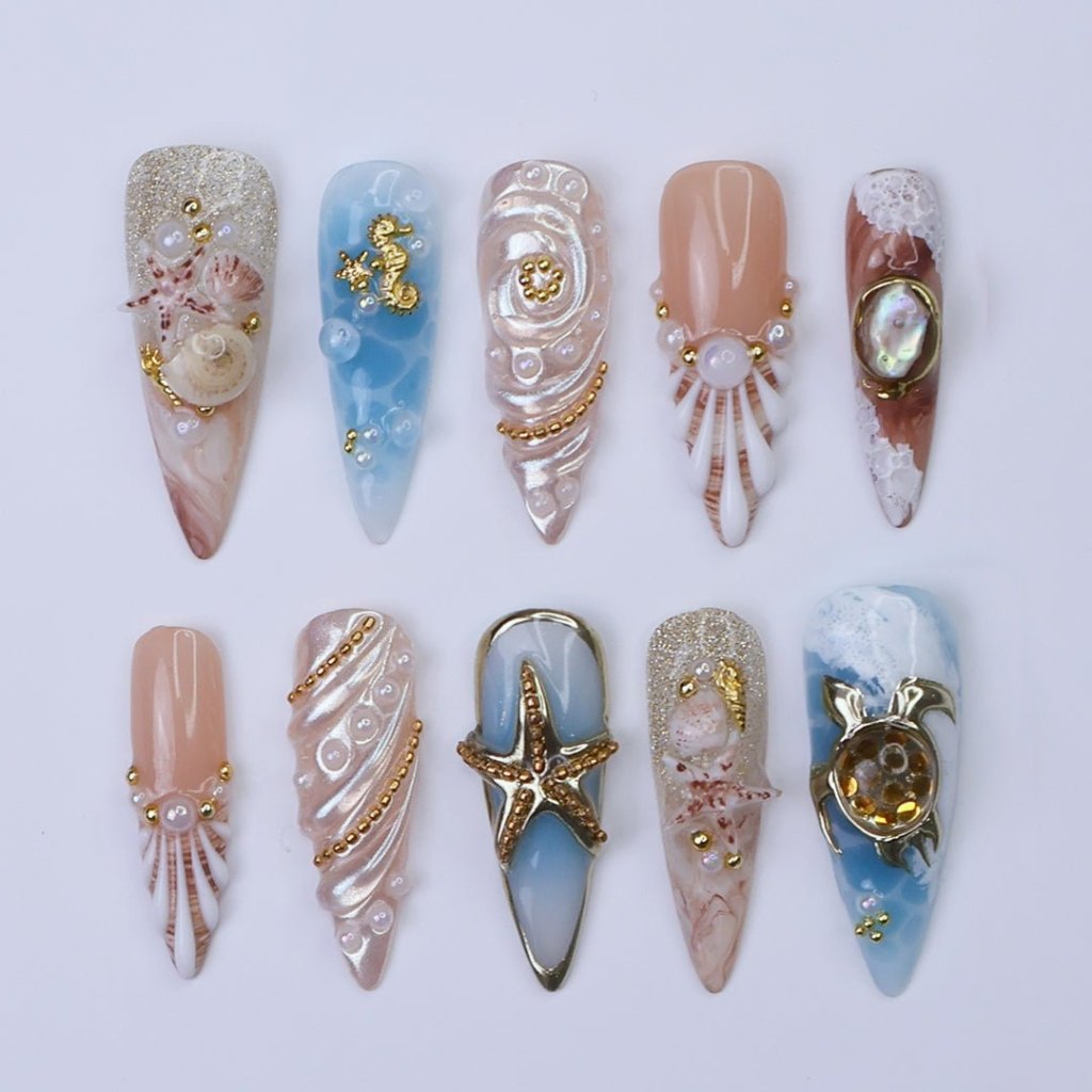 3D ocean press on nails with starfish, seashells, pearls, and turtles — featuring marble wave textures, gold accents, and sculpted shell designs in sandy nude, pearl white, and ocean blue tones — summer vacation nails, beach press on nails, custom handmade nail art, fake nails, false nails, pressons — perfect for coastal getaways, mermaid vibes, or tropical gifting.