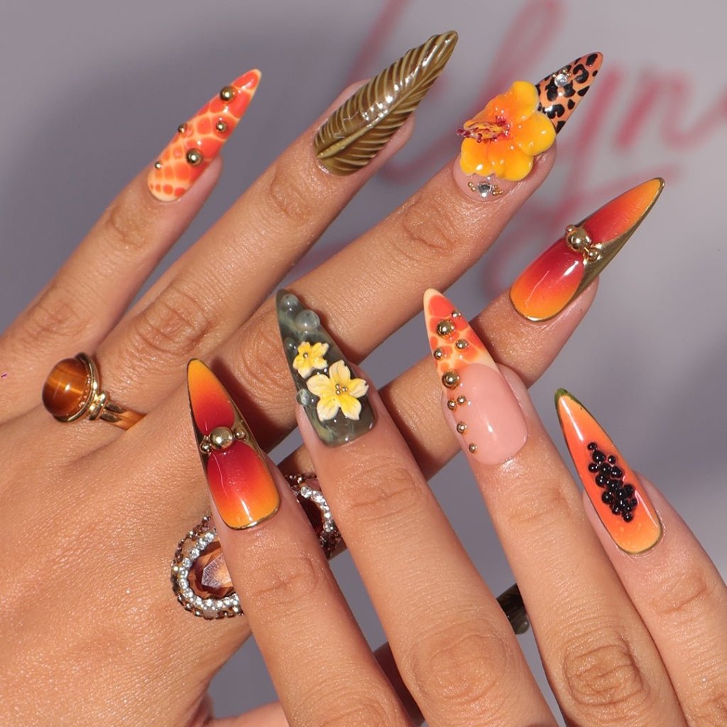3D tropical press on nails with sunset ombré, hibiscus flowers, leopard print, and jungle leaves in orange and olive tones — summer vacation nails, tropical handmade nail art, fake nails, false nails, pressons — perfect for beach getaways or statement summer looks.