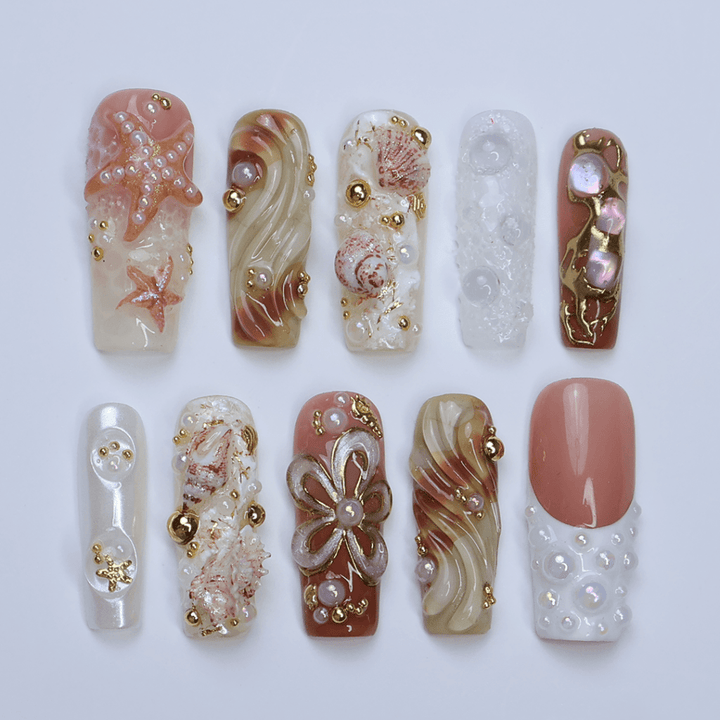 3D luxury beach press on nails with starfish, seashells, pearl clusters, and gold embellishments — featuring sculpted waves, iridescent textures, metallic accents, and under-the-sea details in nude, ivory, and sand tones — summer vacation nails, ocean press on nails, custom handmade nail art, fake nails, false nails, pressons — perfect for coastal getaways, beach photoshoots, or elegant summer looks.