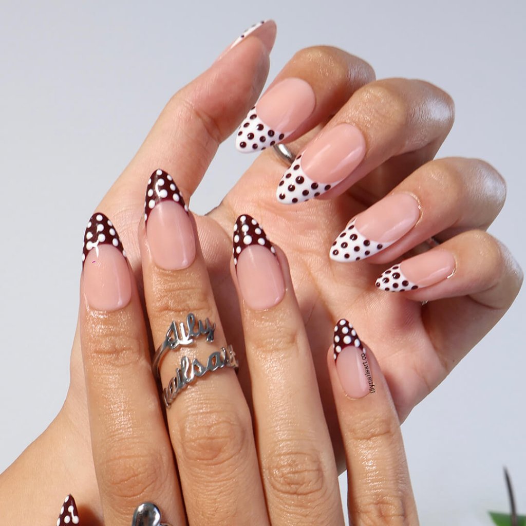 Brown and white polka dot press-on nails with French tip design, medium almond shape — handmade custom fake nails, perfect for holiday style or everyday wear