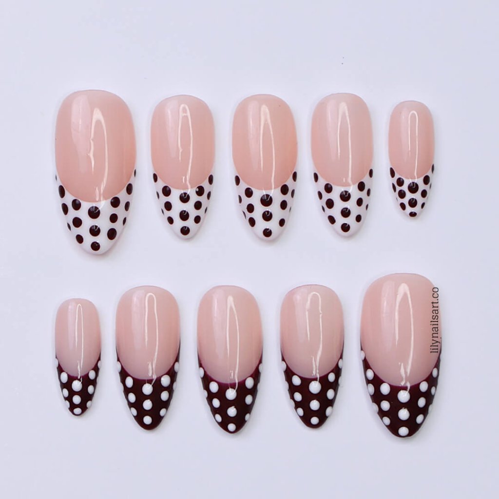 Brown and white polka dot press-on nails with French tip design, medium almond shape — handmade custom fake nails, perfect for holiday style or everyday wear