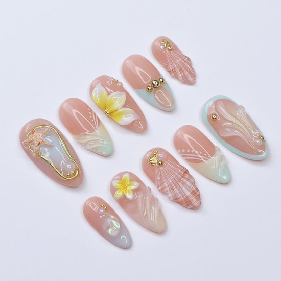 3D beach press on nails with seashells, starfish, plumeria flowers, and soft pastel waves, featuring gold charms, pearl details, and glossy ocean-inspired accents — summer vacation nails, ocean press on nails, custom handmade nail art, fake nails, false nails, pressons — perfect for tropical getaways, beach weddings, or gifting for her.

