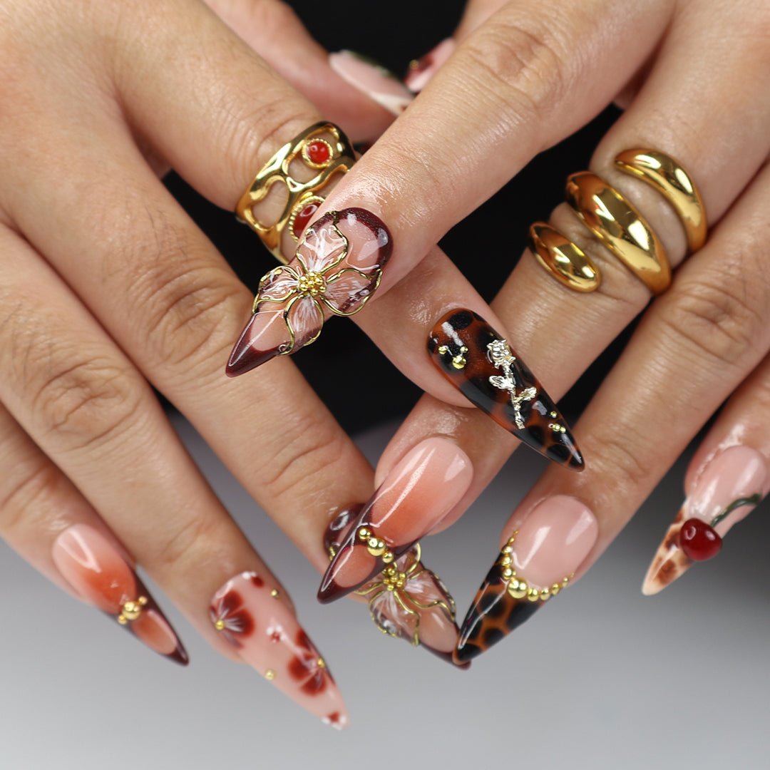 Handmade Press-On Nails with deep cherry tones, 3D floral accents, gold details, and glossy finishes. Perfect for holidays, birthdays, or as a luxurious gift for her