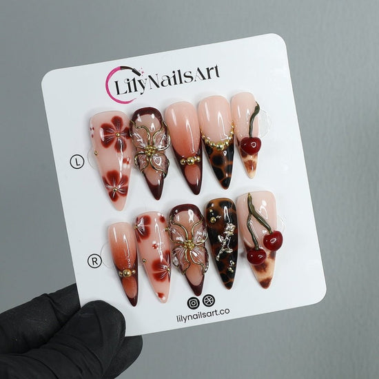 Handmade Press-On Nails with deep cherry tones, 3D floral accents, gold details, and glossy finishes. Perfect for holidays, birthdays, or as a luxurious gift for her