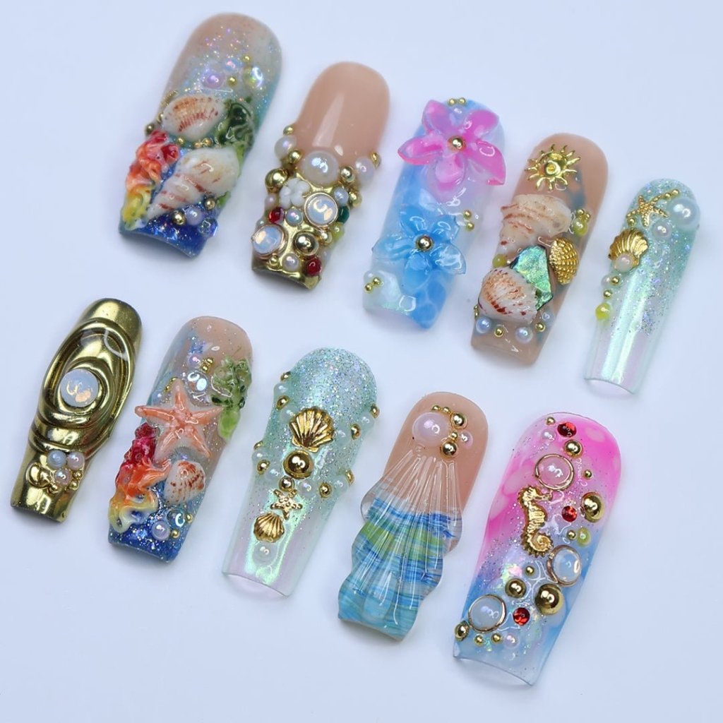 3D ocean-inspired press on nails with gold seashells, starfish, seahorses, pearl accents, and hand-sculpted flowers — featuring iridescent shimmer, coral reef textures, and beachy plaid seashell tips — luxury summer press on nails, beach vacation nails, handmade fake nails, false nails, pressons — perfect for coastal getaways, mermaid-themed looks, or gifting for ocean lovers.
