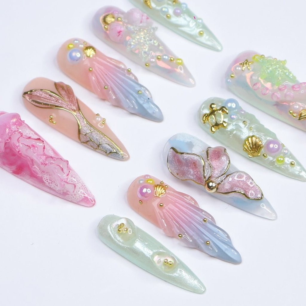 3D pastel press on nails with mermaid tail, pearl accents, seashell charms, and soft ocean shimmer — Seabelle custom handmade nails, summer vacation nails, luxury beach nail art, reusable fake nails, press ons — perfect for beach holidays and dreamy summer escapes.