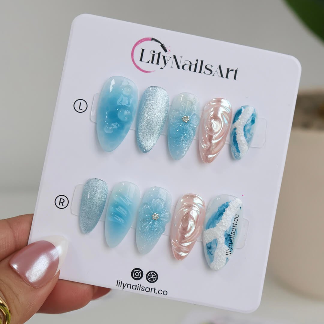 3D ocean-inspired press-on nails with sculpted pearl swirls, water ripple textures, seafoam accents, glitter shimmer, and hand-crafted blue florals — luxury custom made  medium almond nails in blue ocean tones — perfect for beach weddings, summer escapes, holiday, vacation