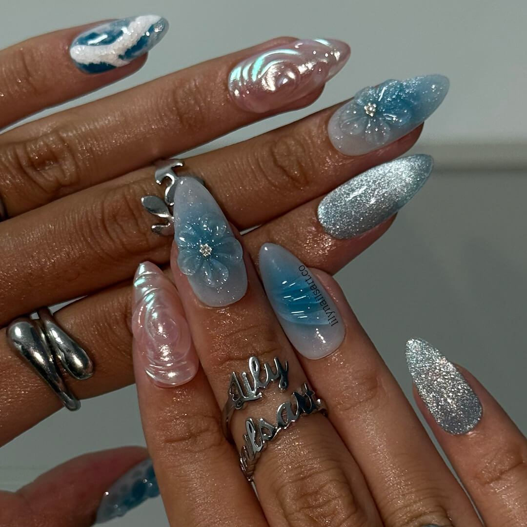 3D ocean-inspired press-on nails with sculpted pearl swirls, water ripple textures, seafoam accents, glitter shimmer, and hand-crafted blue florals — luxury custom made  medium almond nails in blue ocean tones — perfect for beach weddings, summer escapes, holiday, vacation
