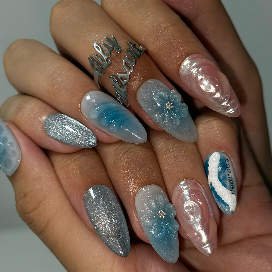 3D ocean-inspired press-on nails with sculpted pearl swirls, water ripple textures, seafoam accents, glitter shimmer, and hand-crafted blue florals — luxury custom made  medium almond nails in blue ocean tones — perfect for beach weddings, summer escapes, holiday, vacation