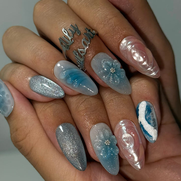 3D ocean-inspired press-on nails with sculpted pearl swirls, water ripple textures, seafoam accents, glitter shimmer, and hand-crafted blue florals — luxury custom made  medium almond nails in blue ocean tones — perfect for beach weddings, summer escapes, holiday, vacation