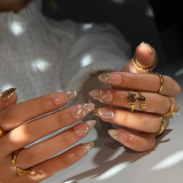 3D blush-to-gold shimmer press on nails with sculpted floral accents, embellished with crystals and pearls on a nude base — custom press on nails, luxury handmade nail art, fake nails, false nails, pressons — perfect for prom, galas, and special occasions
