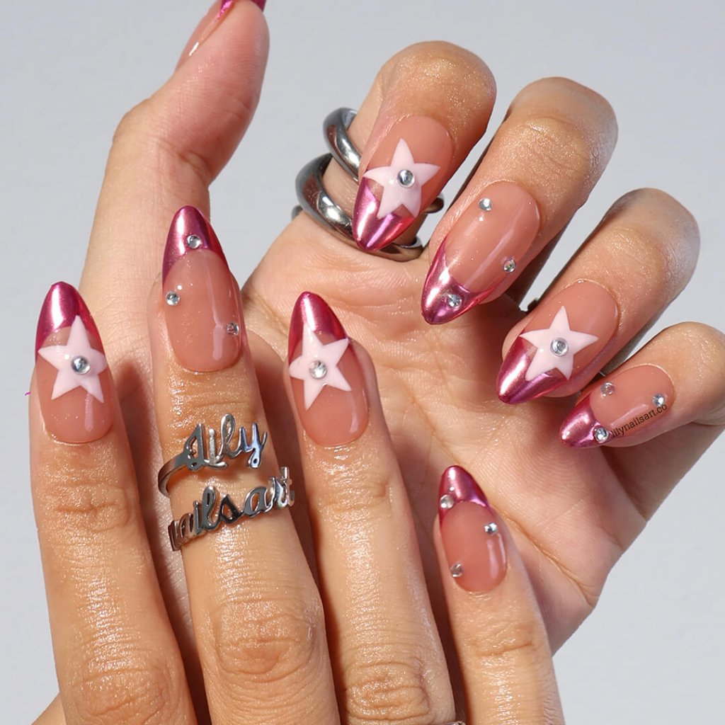 Chrome pink press-on nails with nude bases, 3D pastel star, and rhinestone crystals — handmade medium almond nails with futuristic cosmic design — perfect for parties, festivals, or bold statement looks.