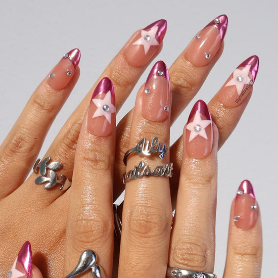 Chrome pink press-on nails with nude bases, 3D pastel star, and rhinestone crystals — handmade medium almond nails with futuristic cosmic design — perfect for parties, festivals, or bold statement looks.