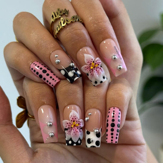 Handmade Medium Square press on nails with a playful mix of pink, black, and white polka dots, 3D pink floral accents, silver bead embellishments, and geometric French tip designs. A bold and feminine style perfect for statement looks.