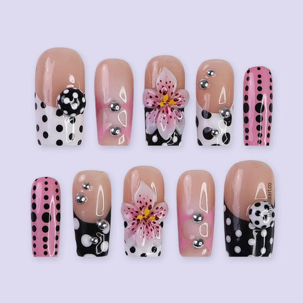 Handmade Medium Square press on nails with a playful mix of pink, black, and white polka dots, 3D pink floral accents, silver bead embellishments, and geometric French tip designs. A bold and feminine style perfect for statement looks.
