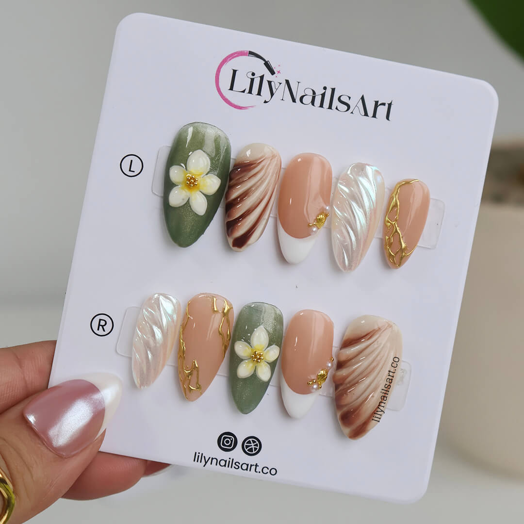 3D press-on nails featuring sculpted flowers, seashell swirl textures, pearl accents, and gold linework — handmade custom nails in earthy sage green, bronze, nude, and soft white tones — perfect for destination weddings, luxury getaways, or elegant summer days, holiday