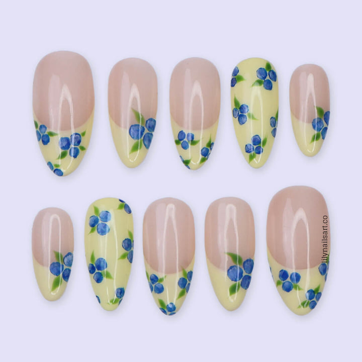 Handmade Blueberry Press On Nails with Yellow French Tips and 3D Florals in Medium Almond shape — reusable summer fruit nail art gift.