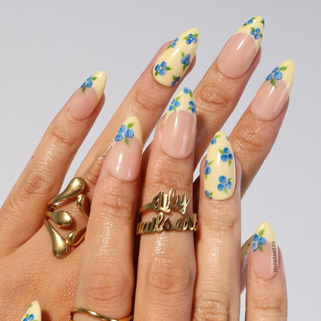 Handmade Blueberry Press On Nails with Yellow French Tips and 3D Florals in Medium Almond shape — reusable summer fruit nail art gift.