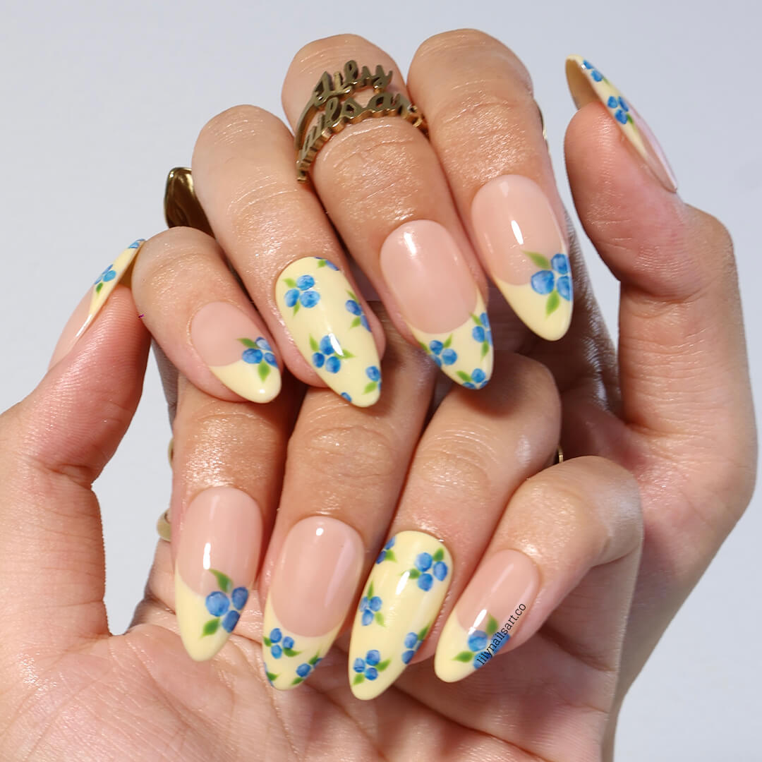 Handmade Blueberry Press On Nails with Yellow French Tips and 3D Florals in Medium Almond shape — reusable summer fruit nail art gift.